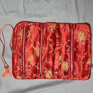 Red satin oriental travel roll 3 zippered pockets and 1 large pocket